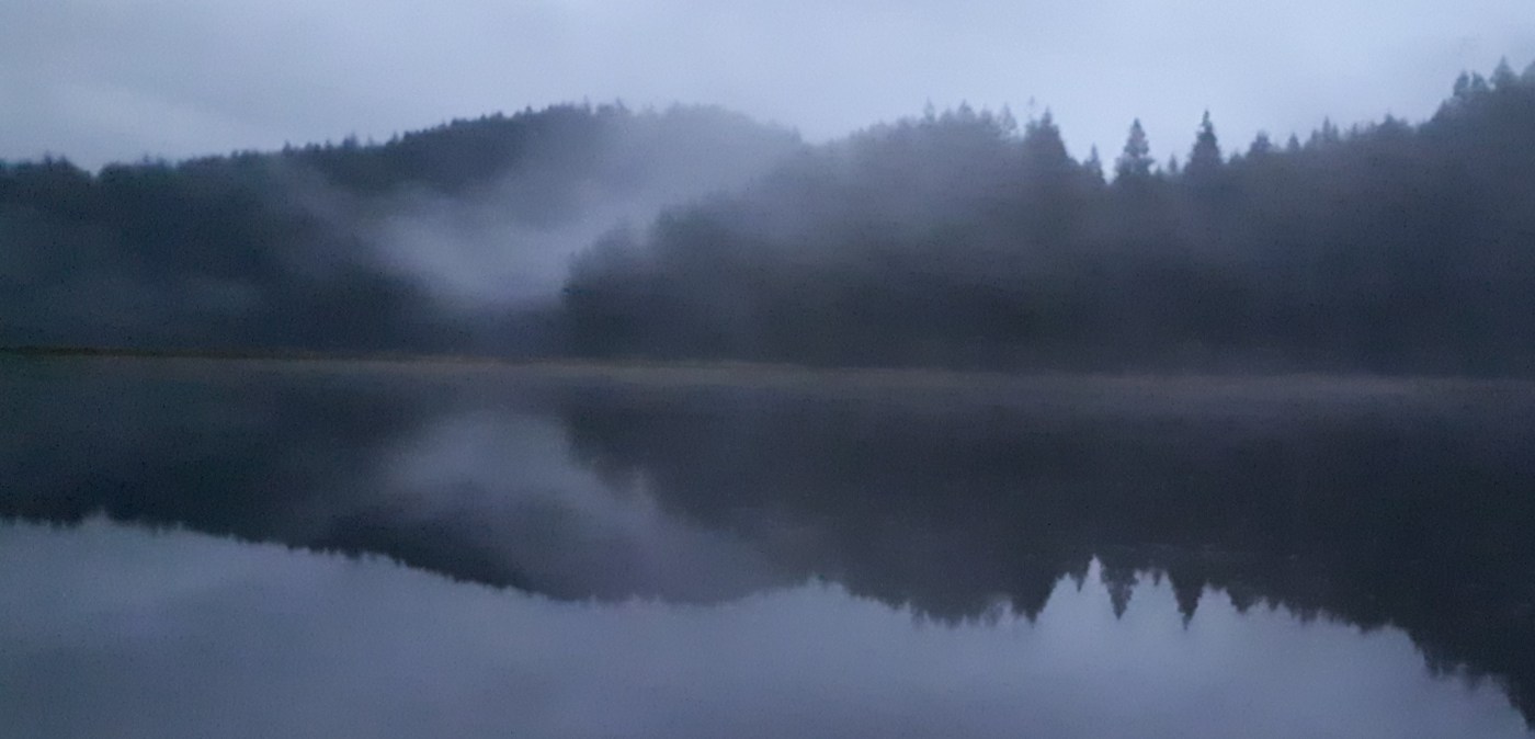 lake with mist and mountains